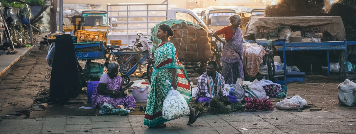 Woman carrying light bag of textiles